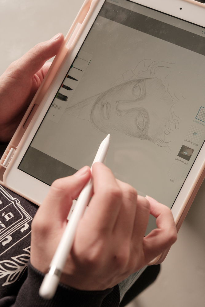 Student Drawing in Tablet